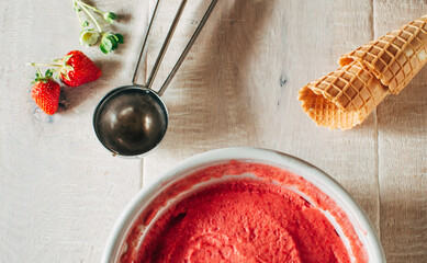 close up of strawberry ice in bowl on table