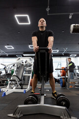 Man in the training gym  working hard after quarantine.