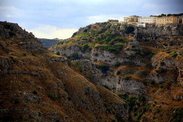 Fototapeta na wymiar View of the ravine and houses on the canyon wall, Matera, European Capital of Culture 2019