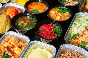 Business lunch in eco plastic container ready for delivery.Top view. Office Lunch boxes with food ready to go. Food takes away. Catering, brakfast