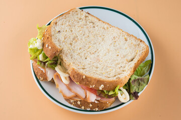 Sandwich of tomato, lettuce and smoked turkey