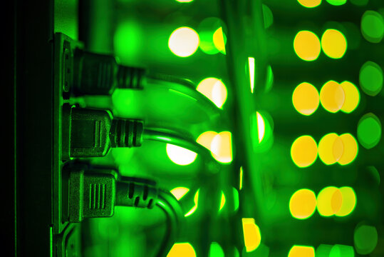 Plugged IEC 60320 C14 power cables to IEC 60320 C13 sockets in a server rack.