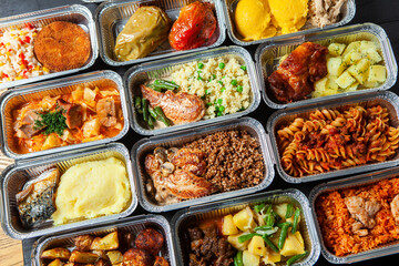 Business lunch in eco plastic container ready for delivery.Top view. Office Lunch boxes with food ready to go. Food takes away. Catering, brakfast.