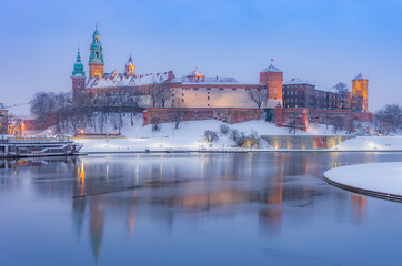 Krakow winter, night /morning Wawel Castle over Vistula river, snow, Poland