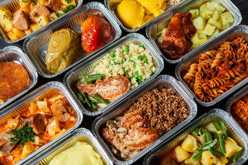 Business lunch in eco plastic container ready for delivery.Top view. Office Lunch boxes with food ready to go. Food takes away. Catering, brakfast.