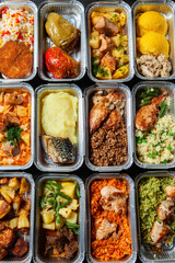 Business lunch in eco plastic container ready for delivery.Top view. Office Lunch boxes with food ready to go. Food takes away. Catering, brakfast.