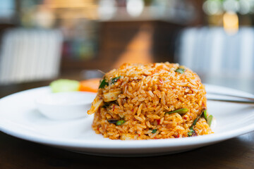 Tom Yum Kung Fried Rice close-up on background bokeh