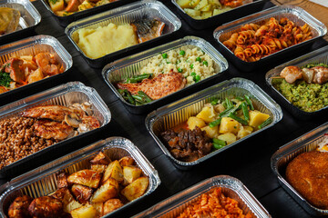Business lunch in eco plastic container ready for delivery.Top view. Office Lunch boxes with food ready to go. Food takes away. Catering, brakfast.