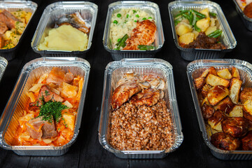 Business lunch in eco plastic container ready for delivery.Top view. Office Lunch boxes with food ready to go. Food takes away. Catering, brakfast.