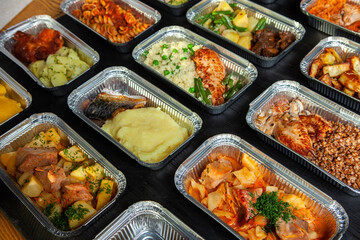 Business lunch in eco plastic container ready for delivery.Top view. Office Lunch boxes with food ready to go. Food takes away. Catering, brakfast.
