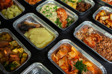 Business lunch in eco plastic container ready for delivery.Top view. Office Lunch boxes with food ready to go. Food takes away. Catering, brakfast.