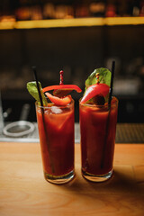 bloody mary on a wooden bar on a dark background