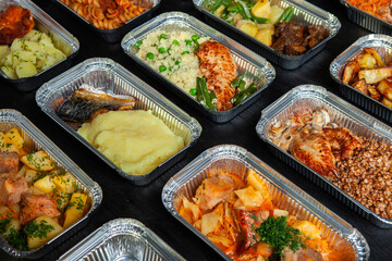 Business lunch in eco plastic container ready for delivery.Top view. Office Lunch boxes with food ready to go. Food takes away. Catering, brakfast.