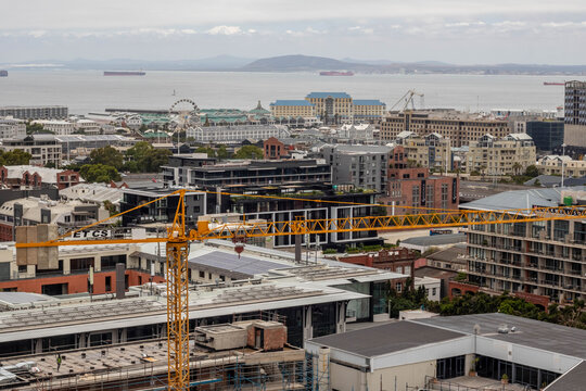 Crain in font of buildings in Cape Town