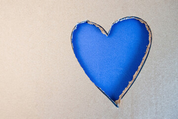 Naklejka na ściany i meble Blue heart shape cut from cardboard. Concept of Saint Valentines day
