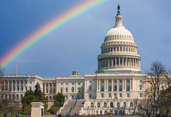West side view of the United States Capitol building under a rainbow, Washington - USA