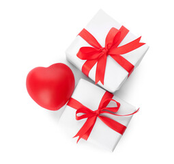 Beautiful gift boxes and red heart on white background, top view. Valentine's day celebration