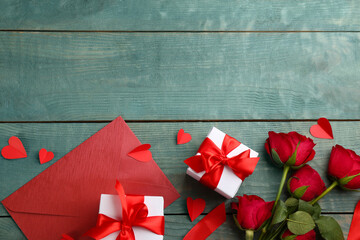 Flat lay composition with gift boxes on wooden table, space for text. Valentine's Day celebration