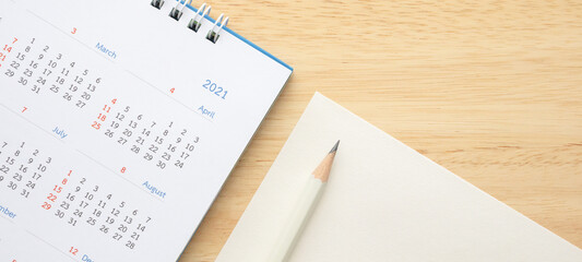 2021 calendar with pencil on wood table background business planning appointment meeting concept