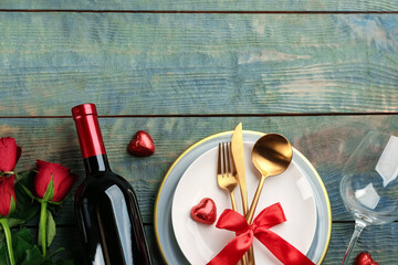 Beautiful table setting on wooden background, flat lay with space for text. Valentine's Day dinner