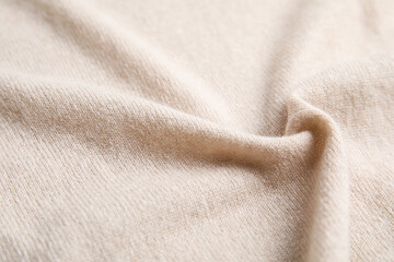 Warm cashmere sweater as background, closeup view