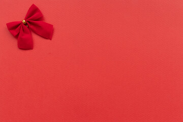red velvet bow on paper background with space for text background image red velvet bow on paper background with space for text background image flatly