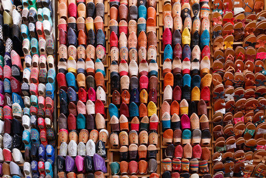 Countless colorful shoes and slippers at a souvenir shop in the medina of Fez, Morocco.