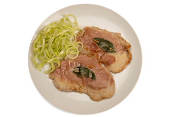 Saltimbocca alla romana (veal with raw ham and sage) on the plate accompanied by puntarelle isolated on white background. Flat lay. Typical second course of Roman cuisine.