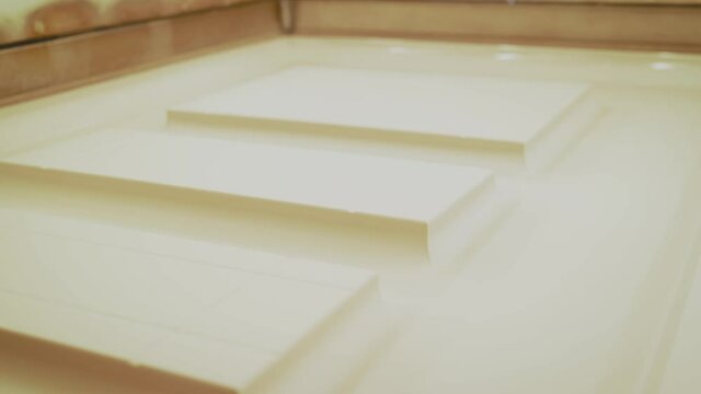 The film is glued to furniture. machine for applying laminated film to a wooden surface. The machine glues the film to furniture at high temperature