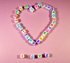 Heart sign made of cubes of letters made of plastic lettering 