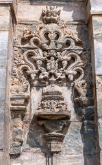 Lakkundi, Karnataka, India - November 6, 2013: Brahma Jinalaya temple. Closeup of brown stone...