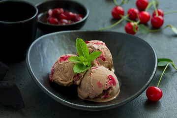 Chocolate ice cream with cherry. Selective focus