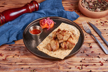 Grilled lamb with vegetables, wooden background