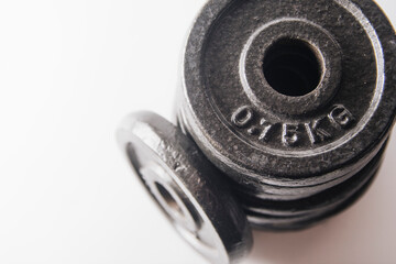 additional weights for dumbbells on a white background