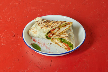Doner grill with meat and vegetables, loft background