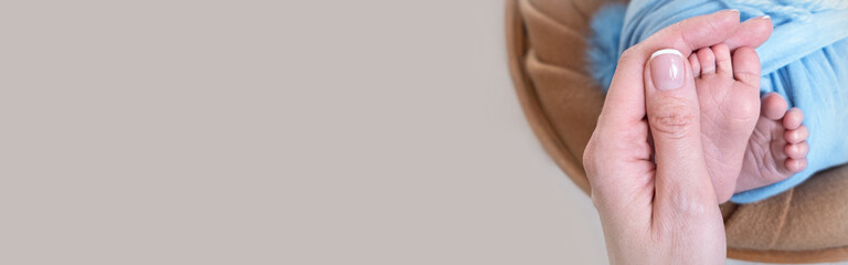 banner. Newborn baby feet. Motherhood concept. Mother day. Copy space. Newborn baby feet. Motherhood concept. Mother day. Copy space.