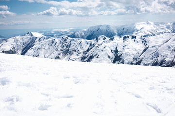Mountain descent and mountains. Clouds in the sky