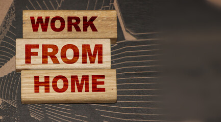 Work from home phrase on wooden blocks. New normal social concept