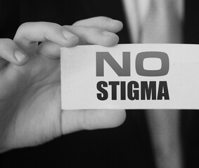 Business card expression say no stigma on businessman hand. Tolerance and equality business concept