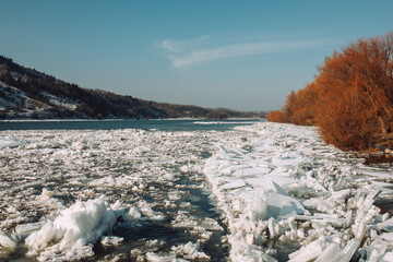 Drift ice floating at river of the northern coast in sunny day. © eduard