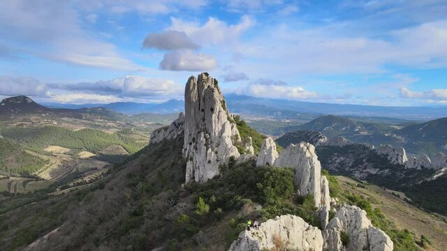 Aerial fly over view of Les Dentelles de Montmirail cliffs in the french alps