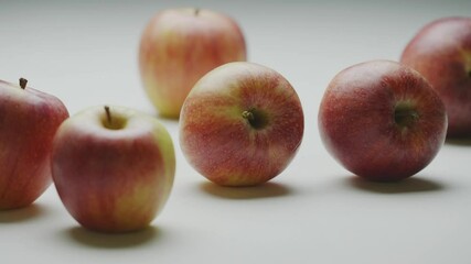 Apples hit, two organic natural moving fruits strike collide with each other, close up studio video
