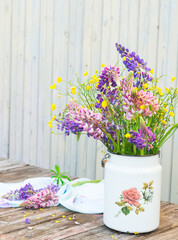 Bouquet of wildflowers. Summer flowers. Lupines and Buttercups. Vintage floral background
