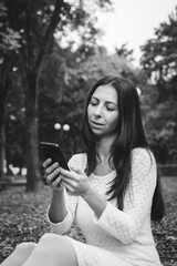 Beautiful brunette girl in autumn park