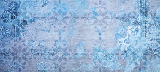 Old blue vintage worn shabby patchwork floral flower leaves motif tiles stone concrete cement wall...