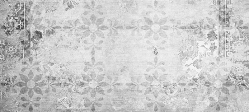 Old gray grey white vintage worn shabby patchwork floral flower leaves motif tiles stone concrete cement wall texture background banner