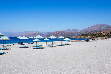 Crete - Scenic seaside of Triopetra beach. Beautiful long pebble beach with few sunbeds. Rethymnon, Greece
