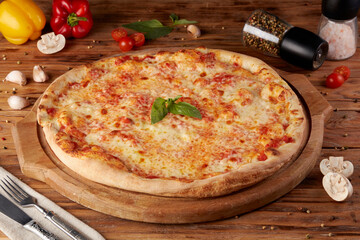Pizza, variant of classic Italian pizza, wooden background
