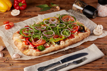 Roman pizza, variant of classic Italian pizza, wooden background