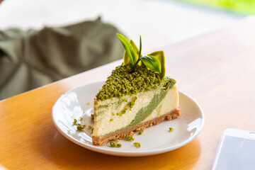 Green tea cheese cake on white dish